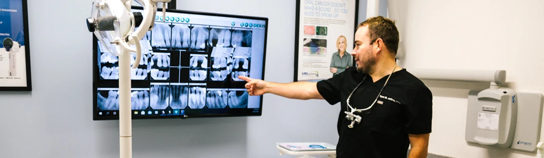 A person pointing at x-rays.