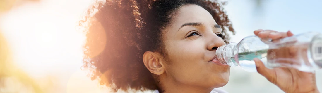 A person drinking water.
